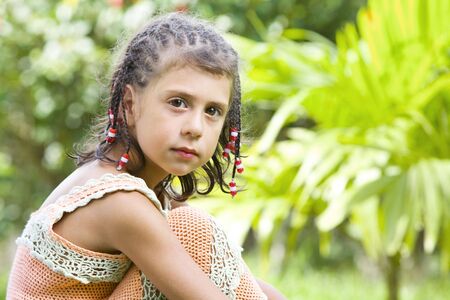 Portrait of little girl having good time in summer environmentの写真素材