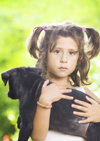 Portrait of little girl having good time in summer environmentの写真素材