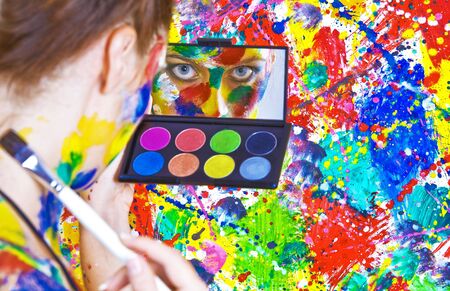 Portrait of young attractive woman on colored backgroundの写真素材