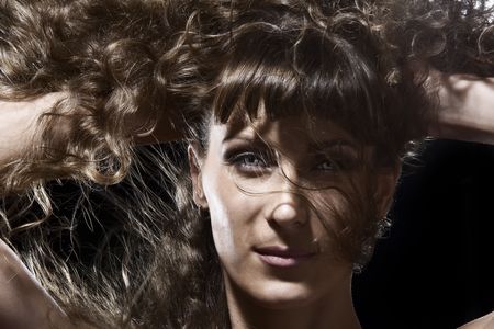 Portrait of young beautiful woman on black backgroundの写真素材