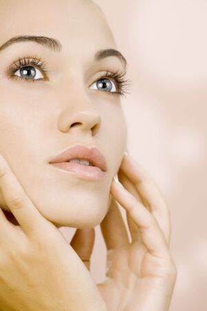 Portrait of nice young  gorgeous woman  on pink backの写真素材
