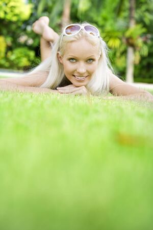 Portrait of young attractive woman having good time in tropic environmentの写真素材