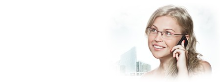 high key portrait of young woman with mobile phoneの写真素材