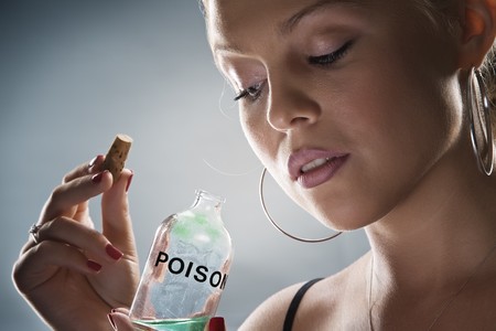 low key portrait of young woman on blue backの写真素材