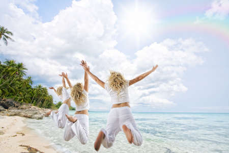 Portrait of nice young women  having good time on tropical beachの写真素材