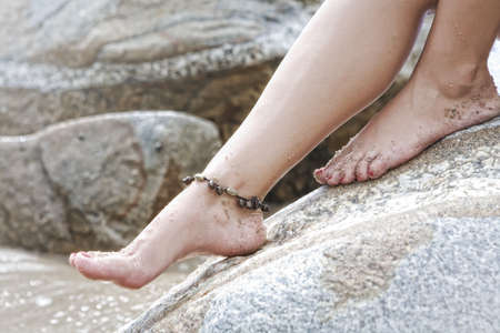 Close up view of womanâs legs on color  backの写真素材