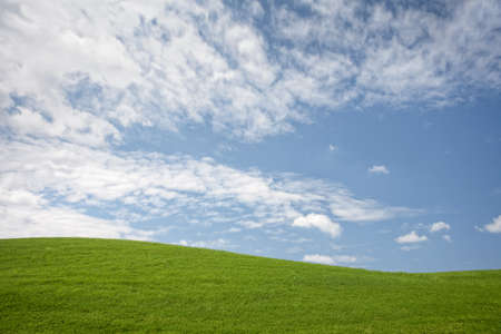panoramic view of nice green hill on blue sky background