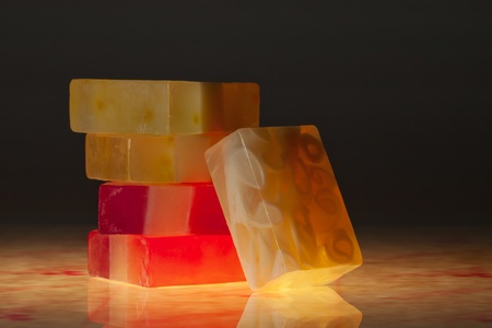 close up view of color soap on black backの写真素材