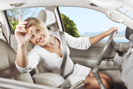 portrait of young beautiful woman sitting in the car