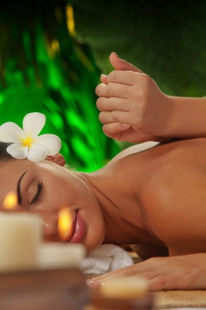 portrait of young beautiful woman in spa environmentの写真素材