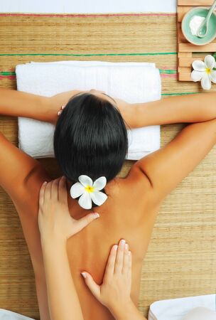 portrait of young beautiful woman in spa environmentの写真素材