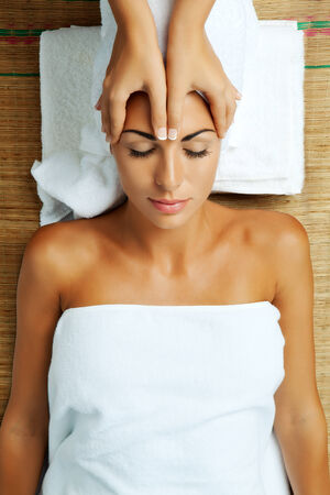 portrait of young beautiful woman in spa environmentの写真素材