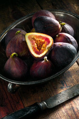 close up view of fresh figs on color backの写真素材