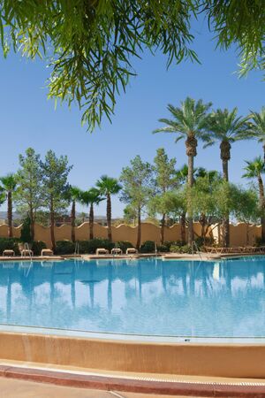 view of  tropical resort swimming pool scene early in the morningのeditorial素材