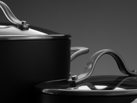 close up view of nice cookware set on grey color backの写真素材