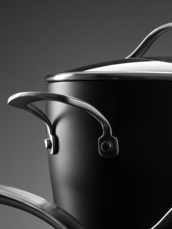 close up view of nice cookware set on grey color backの写真素材