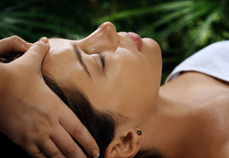 portrait of young beautiful woman relaxing in spa environmentの写真素材