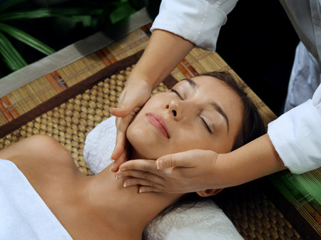 portrait of young beautiful woman in spa environmentの写真素材