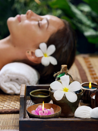 portrait of young beautiful woman relaxing in spa environmentの写真素材