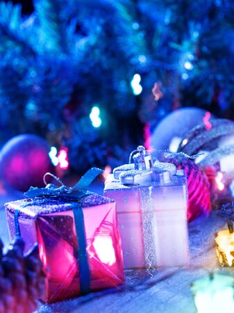 close up view  of gifts boxes  on snowbound  wooden backの写真素材