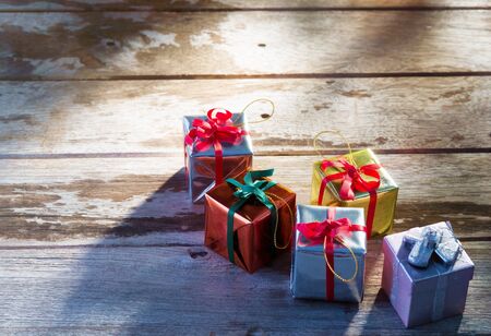 close up view of christmas  gift boxes  on wooden back