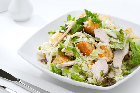 close up view of fresh vegetable salad on white backgroundの写真素材