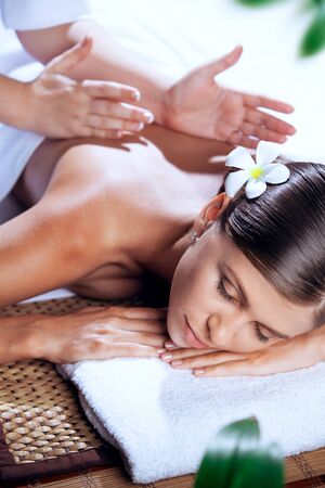 portrait of young beautiful woman in spa environmentの写真素材