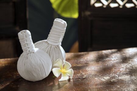 close up view of white Herbal Compresses on color back.の写真素材