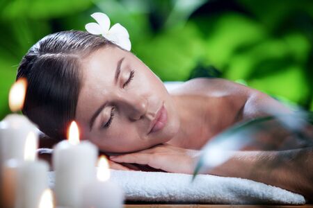 portrait of young beautiful woman in spa environment.