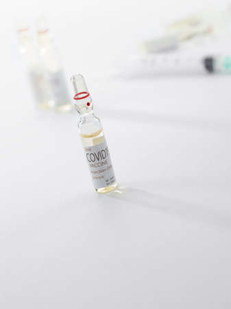 Close up view of the ampules with medicine on white back