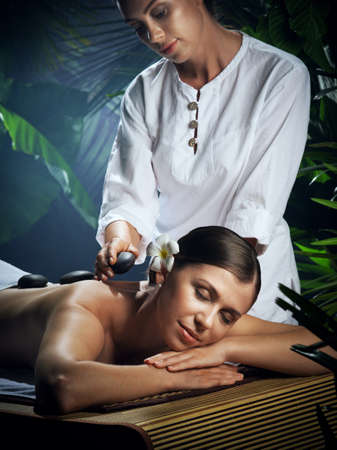 portrait of young beautiful woman in spa environmentの写真素材