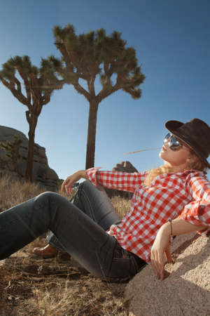 portrait of young beautiful girl in Joshua Tree park environmentの写真素材