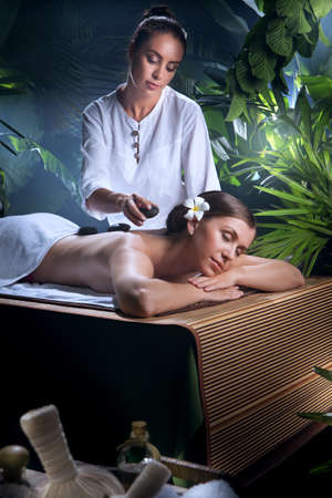 portrait of young beautiful woman in spa environmentの写真素材