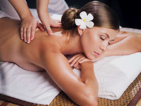 portrait of young beautiful woman in spa environmentの写真素材