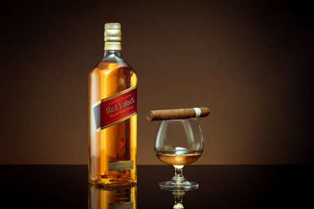 Phuket, Thailand- Feb 2021. Johnnie Walker Red Label blended whisky isolated on color  background. Johnnie Walker is the most widely distributed brand of blended Scotch whisky in the world.のeditorial素材