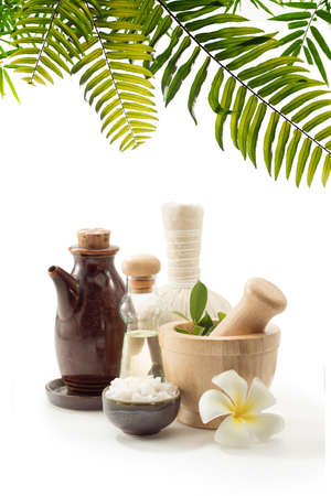 close up view of mortar, salt, oil and Herbal Compress on white back.の写真素材