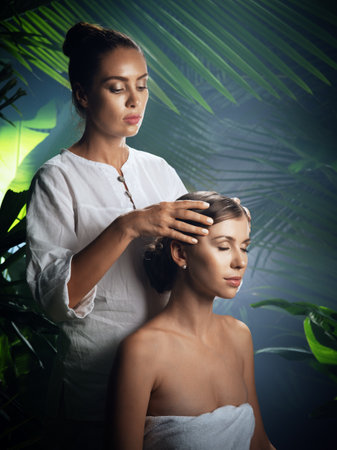 portrait of young beautiful woman in spa environmentの写真素材