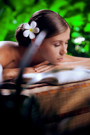 portrait of young beautiful woman in spa environmentの写真素材