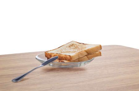 Close up of nice fresh baked toasts on the table to be cut outの写真素材