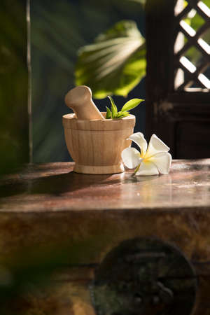 close up view of spa wooden mortar on color backの写真素材