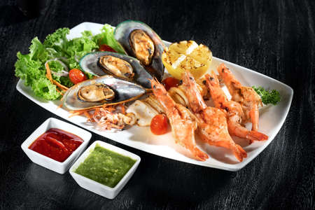 close  up view of nice yummy sea food  on dark backの写真素材