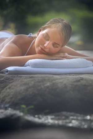 portrait of young beautiful woman in spa environmentの写真素材