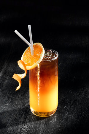 View of fresh orange juice on grey back