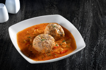 Close up view of nice yummy meatballs with sauce on dark grey backの写真素材