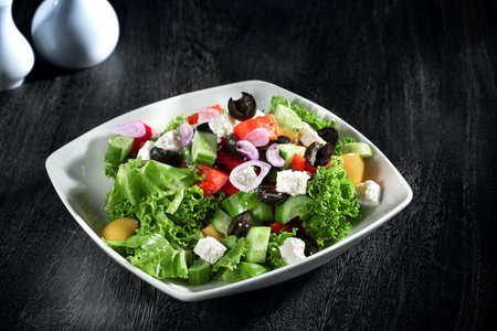 Close up view of Greek salad on dark grey backgroundの写真素材