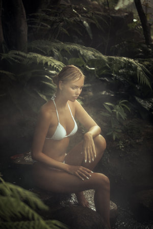 Portrait of young attractive woman having good time in jungleの写真素材