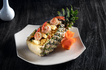Close up view of yummy thai style pineapple rice on grey background