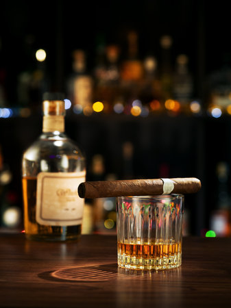 NO LOGOS OR TRADEMARKS!  SELF MADE LABELS! close up view of bottle of whiskey, cigar and glass on color back.の写真素材