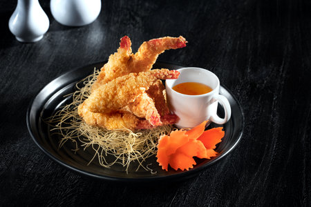 Close up view of nice yummy tempura shrimps on dark grey backの写真素材