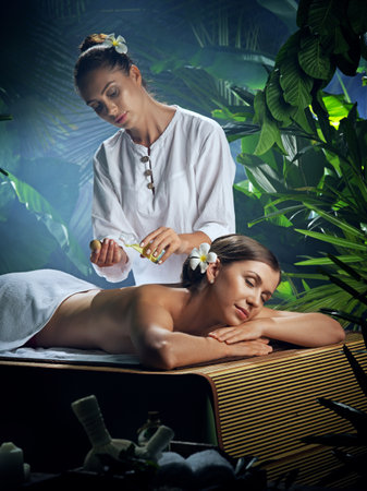 portrait of young beautiful woman in spa environmentの写真素材